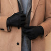 Black leather men’s gloves with finger seams and padded knuckle panels