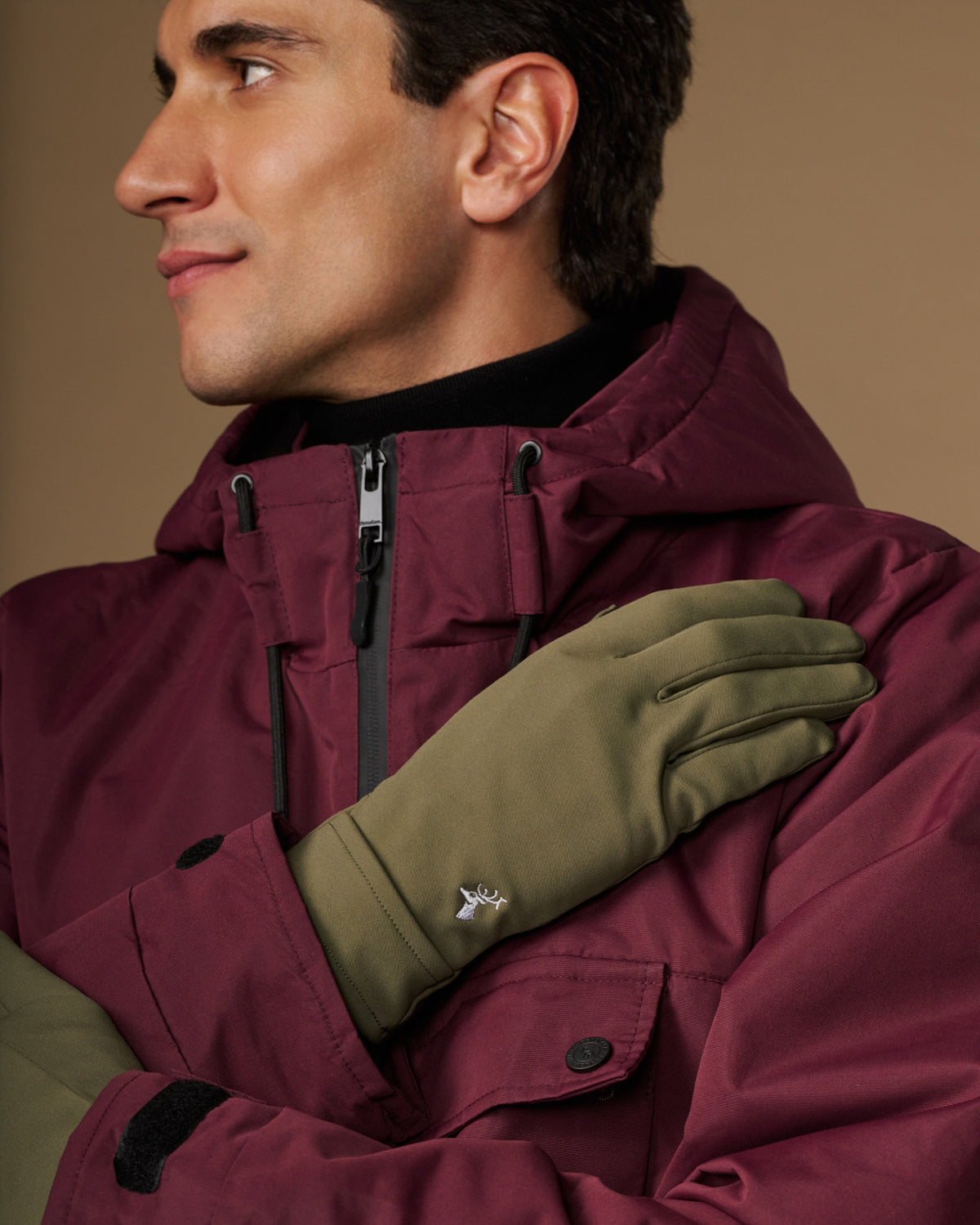 Olive green activity glove with stitched fingers and logo detail