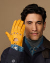 Men's lambskin driving gloves in yellow, touchscreen fingertips, perforated details