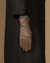 Women’s taupe leather gloves, side view with finger panels and stitched cuff