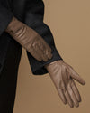 Women’s taupe leather gloves detail, stitched fingers and smooth cuff edge