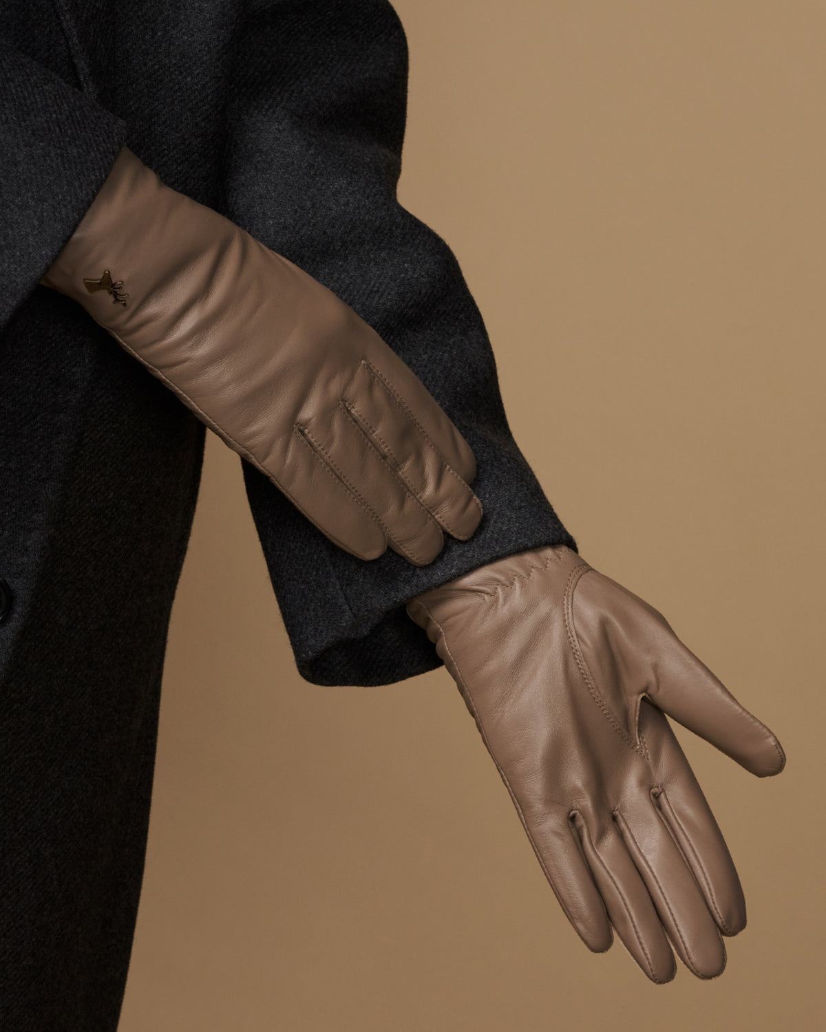 Women’s taupe leather gloves detail, stitched fingers and smooth cuff edge