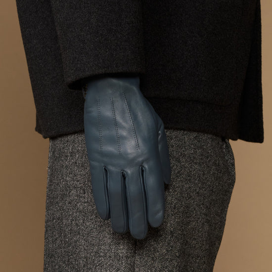 Blue sheepskin gloves with stitched seams and textured cuff