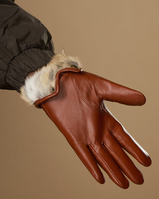 Women’s cognac leather gloves with white rabbit-fur cuff lining and finger seams