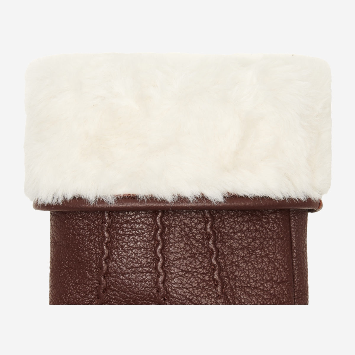 Brown leather glove cuff with thick white faux fur trim