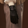 Close-up of woman's black leather glove on her hand