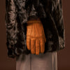 Cognac peccary leather women's glove with cashmere lining, finger seams visible