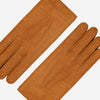 Cognac leather gloves laid flat, long fingers and contrast-stitched seams