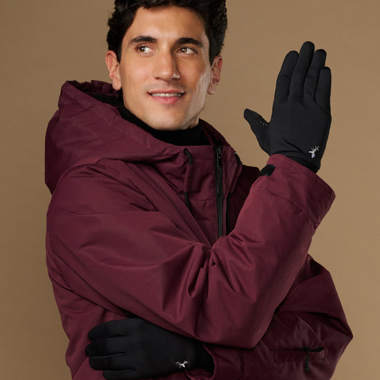 Black activity gloves worn with the smooth backs and small logo visible
