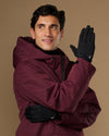 Black activity gloves worn with the smooth backs and small logo visible