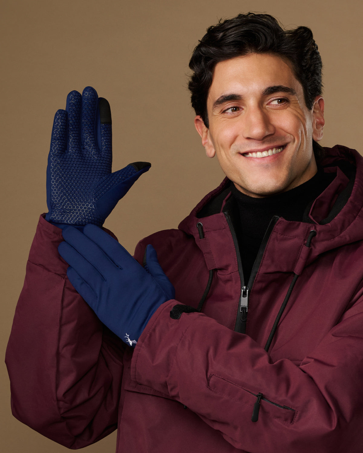 Blue activity gloves with textured grip palms, worn by a model