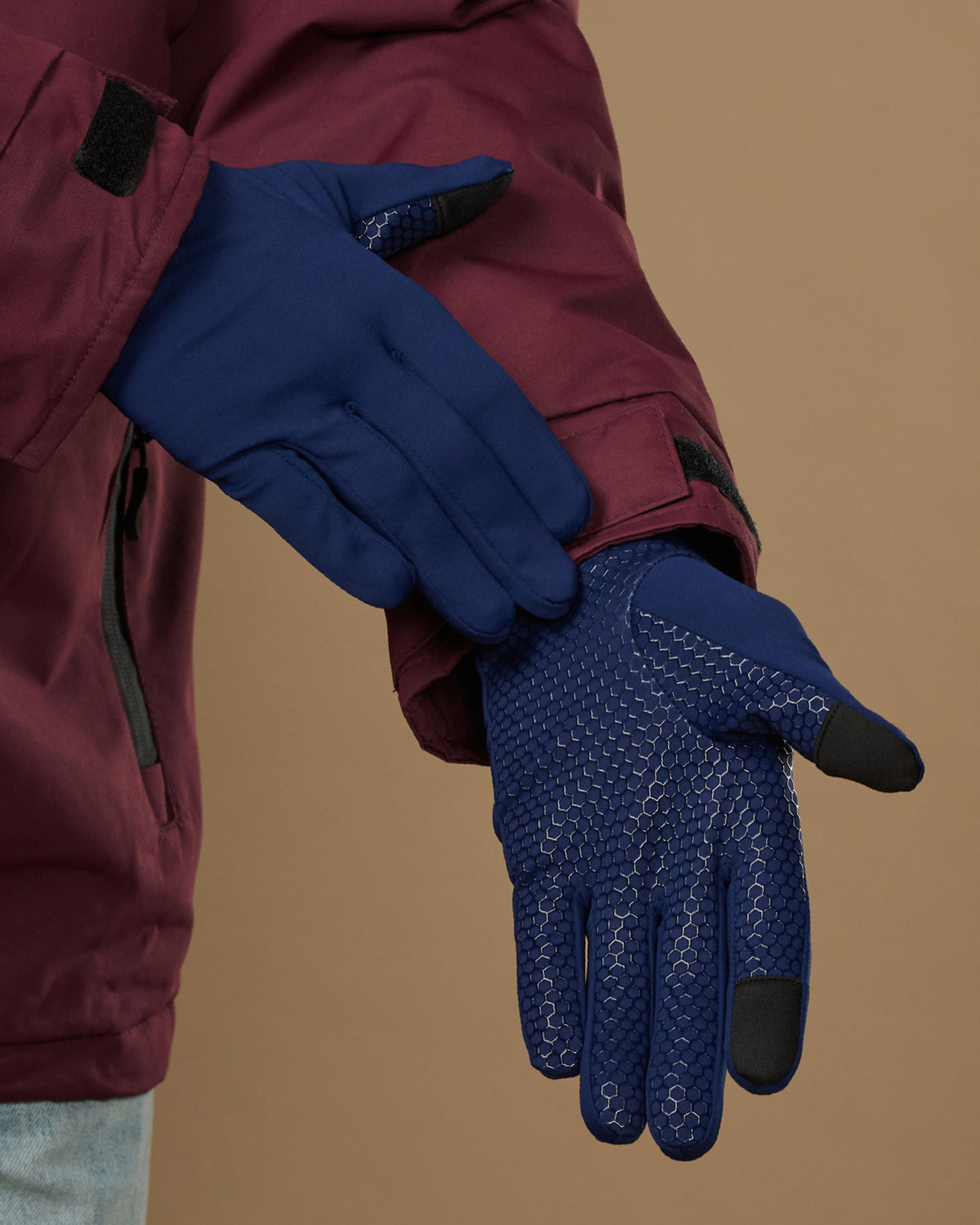 Blue activity gloves showing textured grip palms and touchscreen fingertips