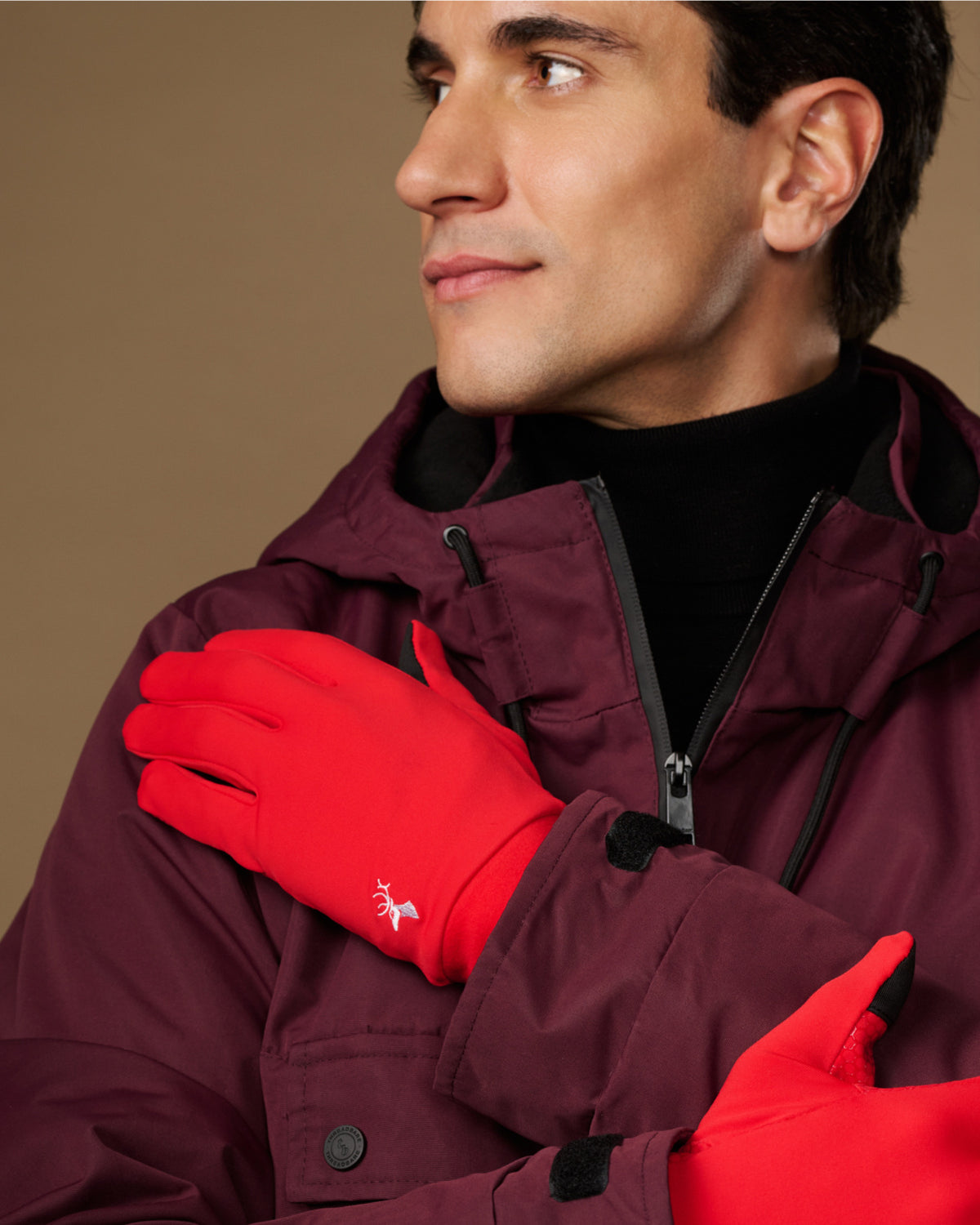 Red men's activity glove with smooth back and small white wrist logo