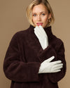 Women’s white leather gloves with smooth lining, full-finger fit and curved shape