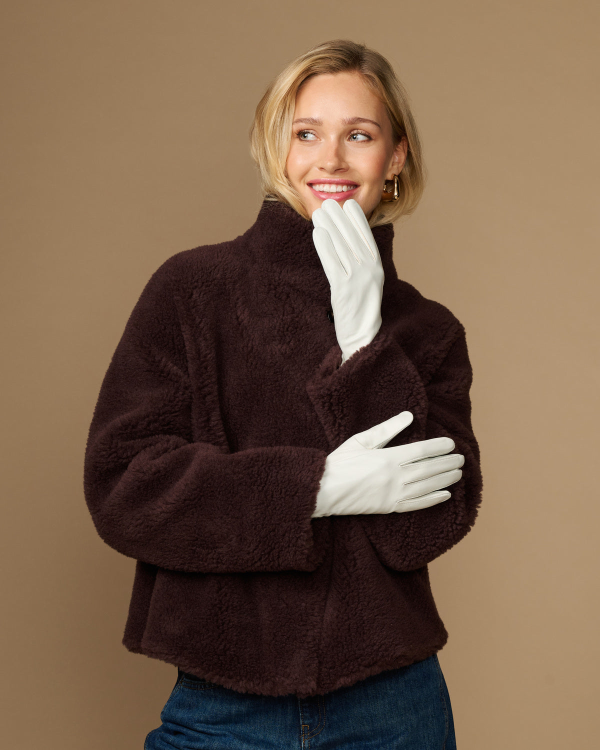 Women’s white leather gloves with smooth lining, full-finger design and flexible fit