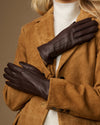 Brown fleece-lined leather gloves, hands raised to show glove shape