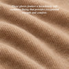 Beige cashmere lining fabric detail inside a glove cuff