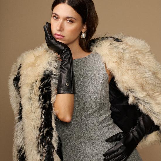 Black leather below-elbow glove with ruched cuff and touchscreen fingertips, glossy