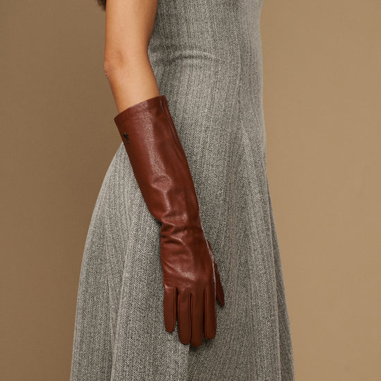 Cognac leather below-elbow gloves, long fitted cuffs and tapered fingers