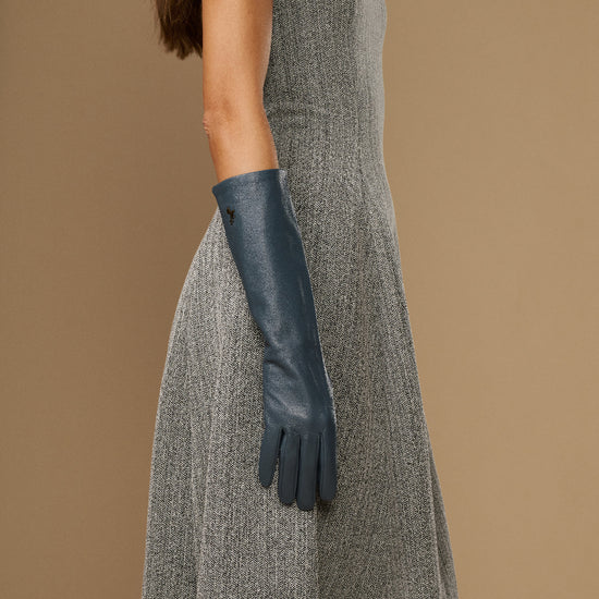 Women’s grey below-elbow leather glove on forearm with fitted fingers