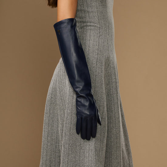 Women's blue leather elbow gloves with fitted cuffs and finger openings