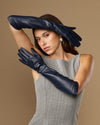 Women's blue leather elbow gloves with long cuff and glossy finish