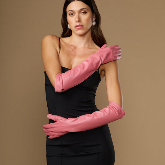 Pair of pink elbow-length leather gloves with smooth finish and long cuffs