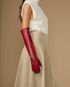 Red leather elbow gloves with long cuff and fitted finger panels