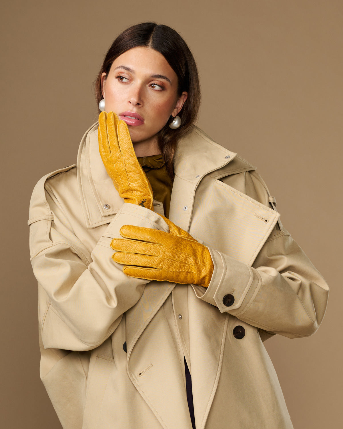 Yellow deerskin leather gloves with stitched finger panels and shaped wrist cuff