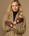 Brown leather driving gloves with elastic wrist and perforated knuckle details