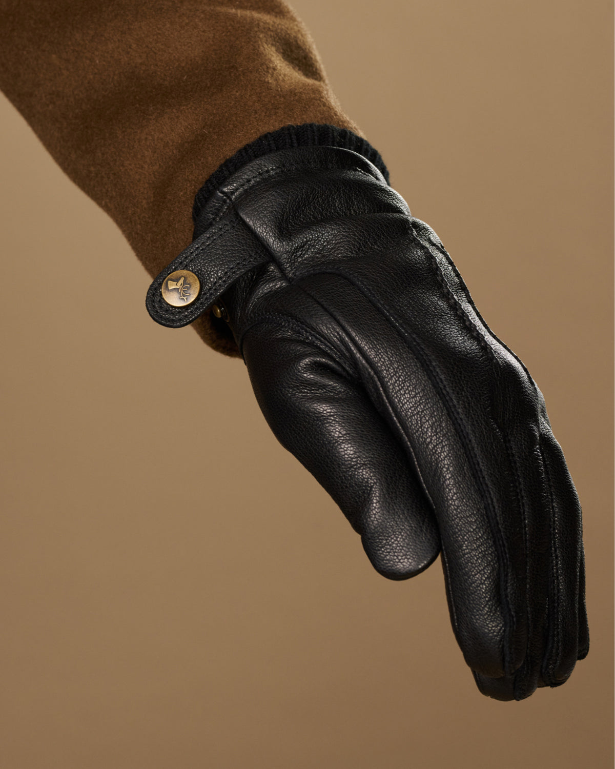Black goatskin leather glove cuff with press-stud and textured stitching