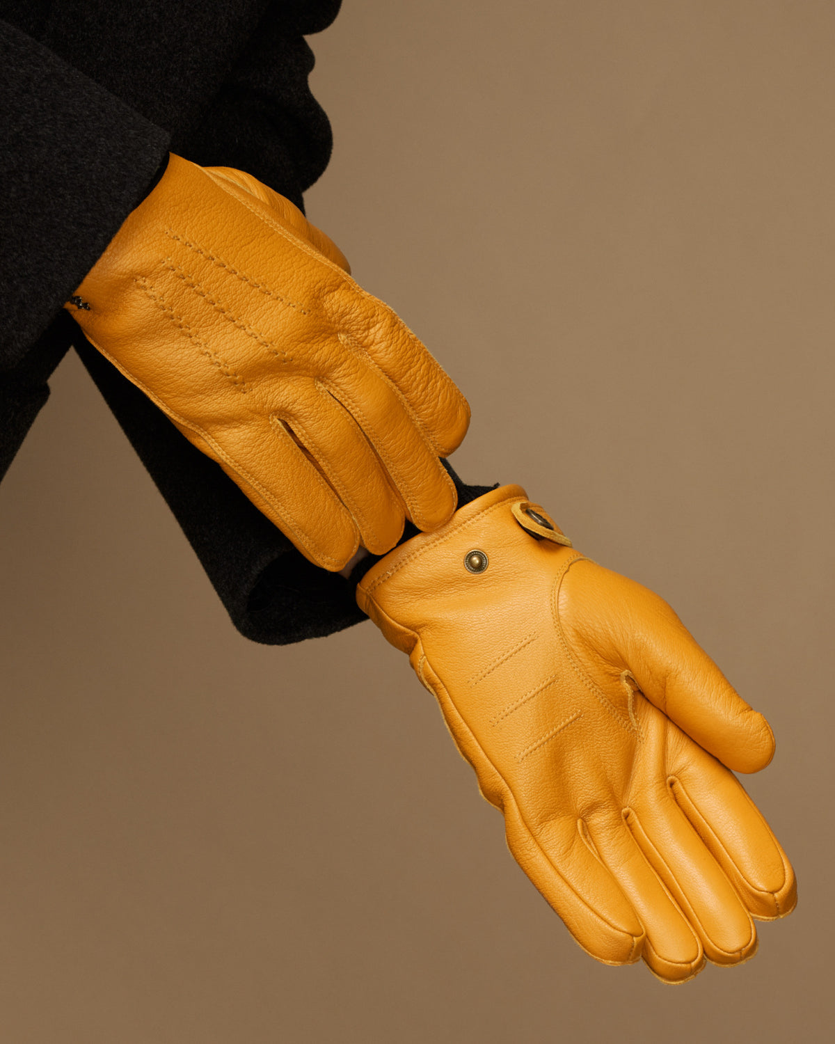 Yellow goatskin gloves with press-stud strap and fitted fingered cuff