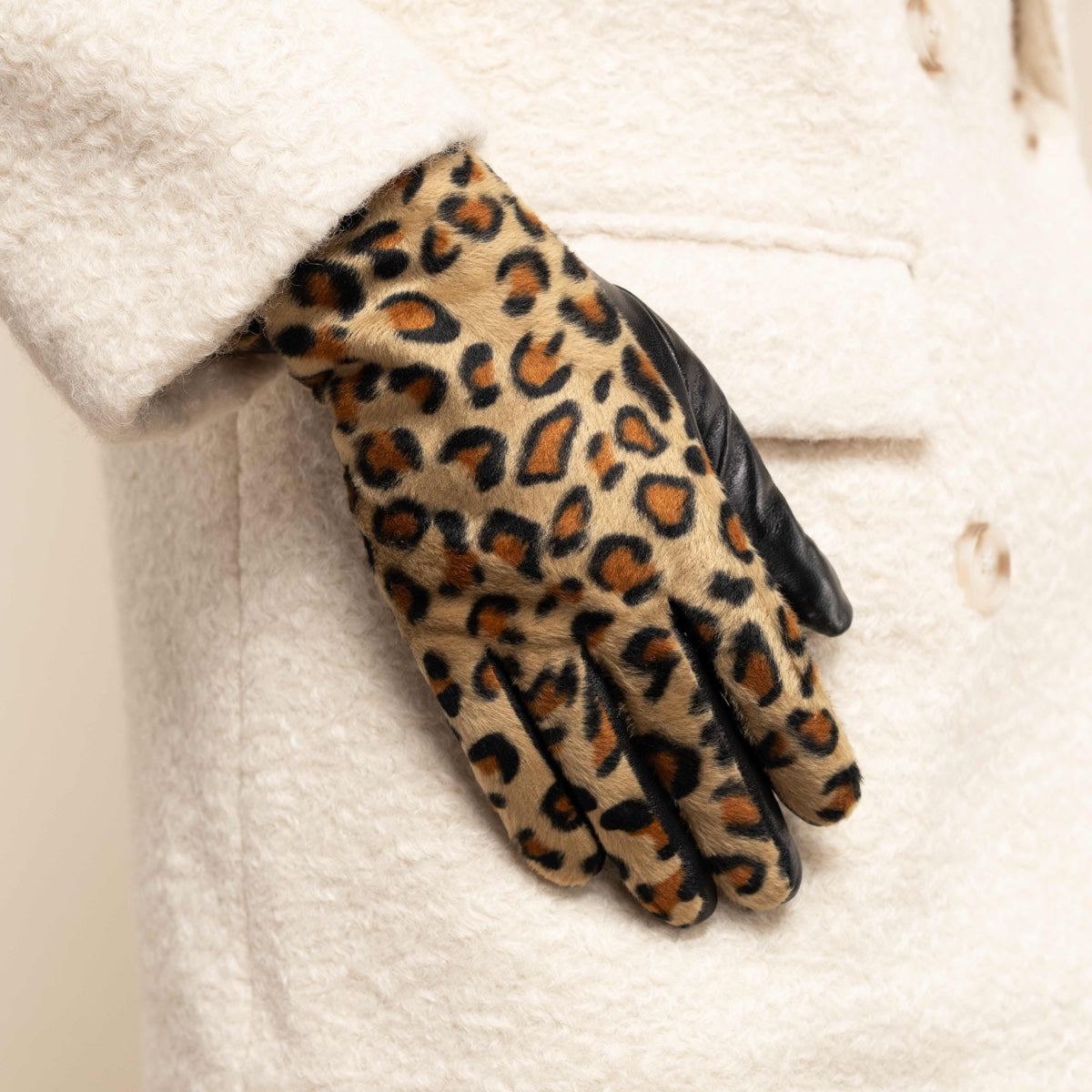 Leopard print fleece-lined glove with black leather back and tapered fingers